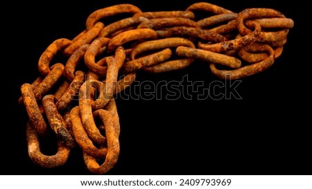 Close up shot of rusty chain isolated on black background.