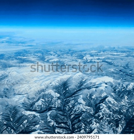 a picture of a Mountain covers in snow from the sky