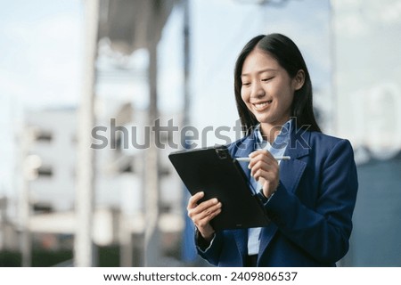 Email notification concept, Business woman use Tablet and laptop receive message alert in the mailbox.