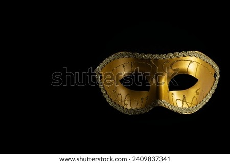 Carnival mask, a vintage accessory suitable for opera or theater, black background, copy space