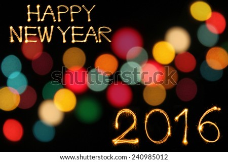 Happy new year 2016 writing sparkles firework with dirty defocused light blur bokeh background Royalty-Free Stock Photo #240985012