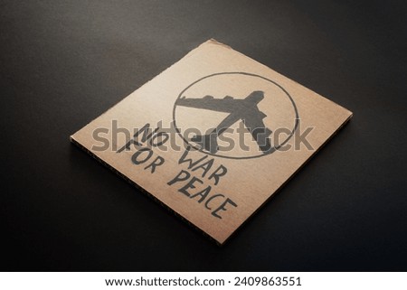 cardboard placard war peace lettering Royalty-Free Stock Photo #2409863551