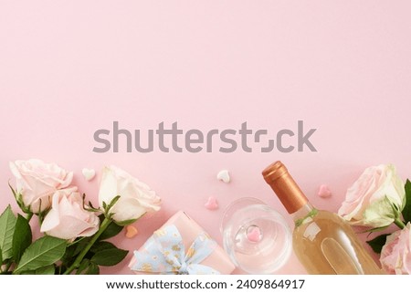 Special Valentine's Day dinner affair. Top view shot of plates, cutlery, hearts, roses, white wine, wine glass, present box on pastel pink background with advert space
