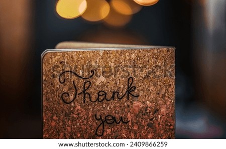 Cork Greeting Card over Soft Focus Background. Stylish Modern Postcard with Text Thank You. Traditional Thanksgiving Day Decorations