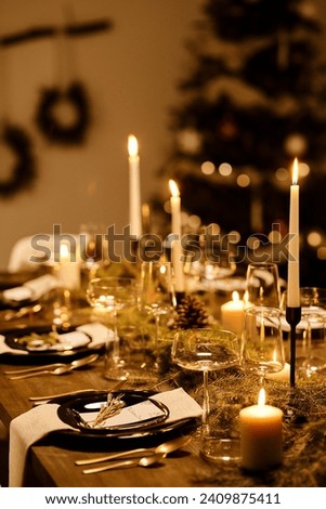 lit candle on a festive decorated dinner table.
Wonderful candle light dinner in the restaurant. picture is most beautiful.