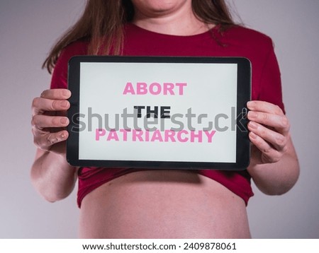Unrecognizable woman with banner supporting abortion rights
