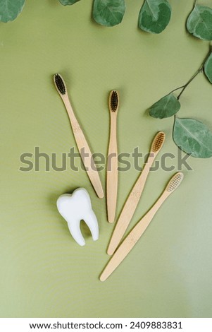 Tooth and eco tooth brushes on a beige background. Concept of dental examination of teeth, health and dental hygiene. Prevention of caries and tartar teeth.