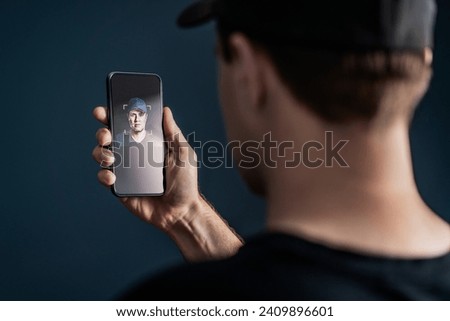 Face recognition with facial scan in phone. Identification and verification to unlock smartphone. Deep fake technology. Man using cellphone. AI mobile tech and biometric id authentication. Data access Royalty-Free Stock Photo #2409896601