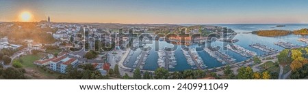 Panoramic drone picture of the Croatian harbor town of Vrsar on the Limski Fjord from the church bell tower during daytime