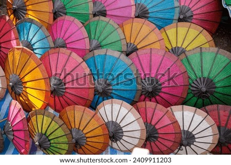 Colorful paper umbrellas stacked together
