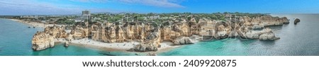 Panoramic drone picture over Praia do Marinha beach in Portuguese Algarve during daytime in summer Royalty-Free Stock Photo #2409920875