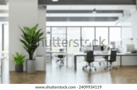 Blur background of modern office interior design . Contemporary workspace for creative business include chairs, table and interior plant