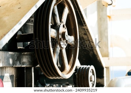 Maintain flywheel transmission systems on drilling rigs. Royalty-Free Stock Photo #2409935219