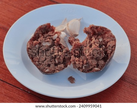 Sour beef Thai food style, fermented beef with garlic and salt. Royalty-Free Stock Photo #2409959041