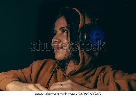 woman with a cream color hoodie, listening to the music and enjoying, women with headphone, enjoying to the song with multiple poses.