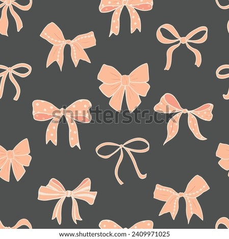 Seamless vector pattern with various peach colored feminine bows and hearts on charcoal grey. Textile