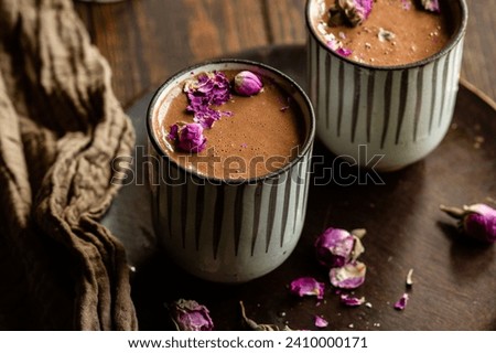 A photograph of mugs of homemade, healthy hot chocolate or cacao in a cacao ceremony Royalty-Free Stock Photo #2410000171