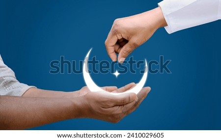Eid al-Fitr and Ramadan concept background. Giving zakat or sadaqah to poor people Islamic concept background. Royalty-Free Stock Photo #2410029605