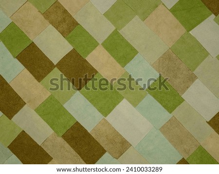 Handmade background in patchwork style with cotton fabric elements in green tones Royalty-Free Stock Photo #2410033289