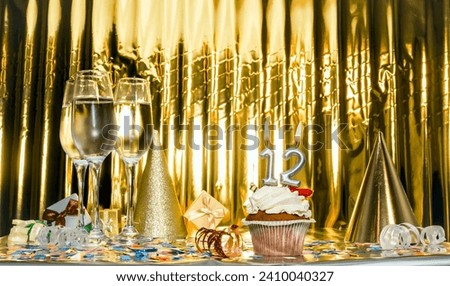 Background date of birth with number 12. Scenery festive glasses of champagne, anniversary in golden color. Copy space. Happy birthday postcard.