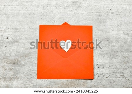 Expressive Love: A Captivating Image of a Red Love Letter Envelope Set Against a Subtle Grey Background