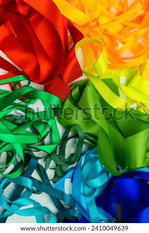 Rainbow ribbons. Flat lay. Multicolored tapes. Rainbow-colored adhesive tape. A set of bright sticky decorative ribbons for creativity, gift box packaging, making postcards. Materials for making craft