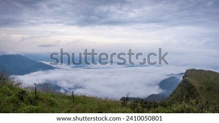 Panoramic Landscape picture of San nok wua moutain with sea of mist and morning cloudy sky, Khao San Nok Wua, Khao Laem National Park, Kanchanaburi, Thailand