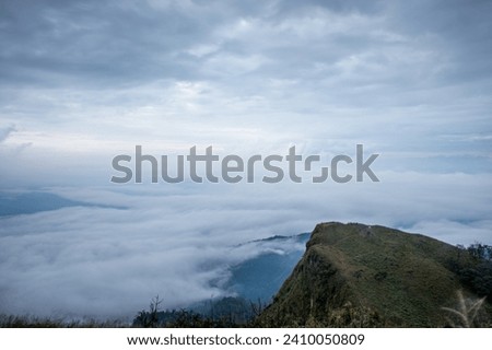 Landscape picture of San nok wua moutain with sea of mist and morning cloudy sky, Khao San Nok Wua, Khao Laem National Park, Kanchanaburi, Thailand