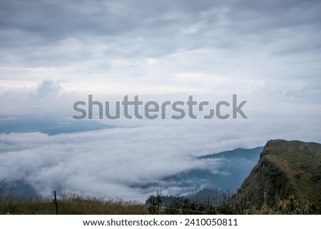Landscape picture of San nok wua moutain with sea of mist and morning cloudy sky, Khao San Nok Wua, Khao Laem National Park, Kanchanaburi, Thailand