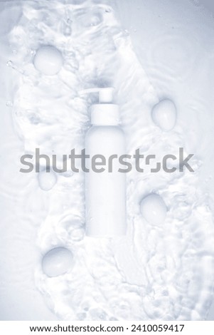 Beauty product bottle with a fresh water theme background.