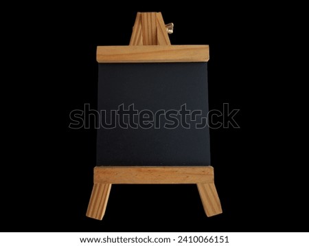 Sleek Elegance: Easel-Shaped Picture Frame on a Black Background, Providing a Stylish Canvas for Treasured Memories, Harmonizing Functionality and Aesthetic Appeal in a Modern Noir Setting