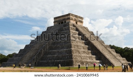 Side view of the temple of Kukulkan (Mayan pyramid of El Castillo) at the archaeological ruins of Chichen Itza - November 2023 - Yucatan, Mexico Royalty-Free Stock Photo #2410069945