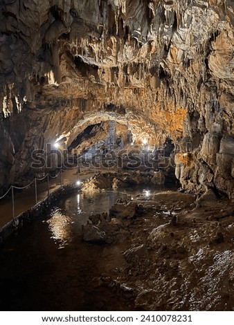 Deep nice cave with stalactite and stalagmite. 