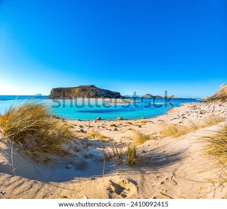 Amazing view of Balos Lagoon with magical turquoise waters, lagoons, tropical beaches of pure white sand and Gramvousa island on Crete, Greece Royalty-Free Stock Photo #2410092415