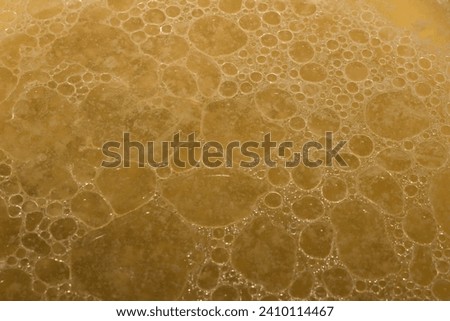 Full frame of oil bubbles after cooking meat