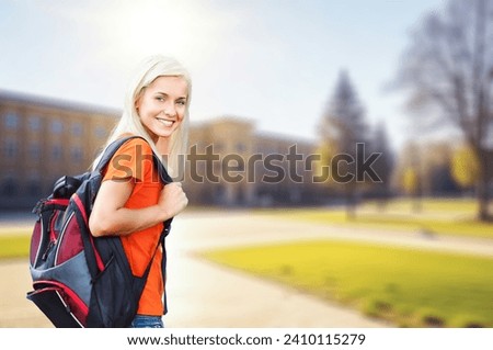 Happy smiling student  in university park