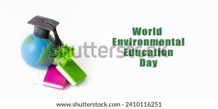 World Environmental Education Day text. Globe with green twig, graduated cap and books banner background