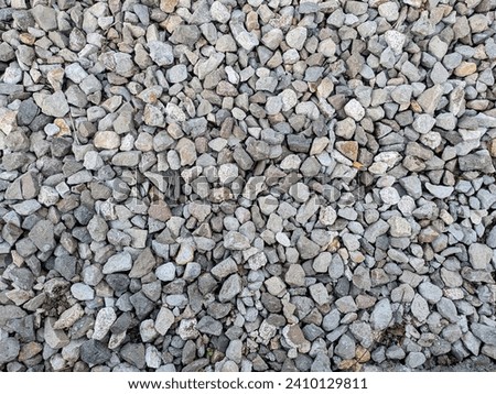 A pile of rocks in a natural setting. The rocks are of various shapes, sizes, and colors. Royalty-Free Stock Photo #2410129811