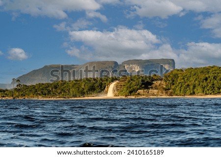 Hacha waterfall in the lagoon of the Canaima national park before the storm - Venezuela, Latin America Royalty-Free Stock Photo #2410165189