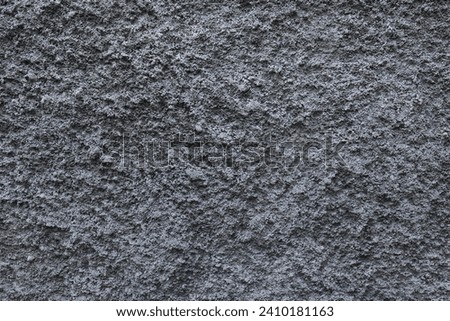 grey wall with grainy pattern and rough surface. Abstract textured white.