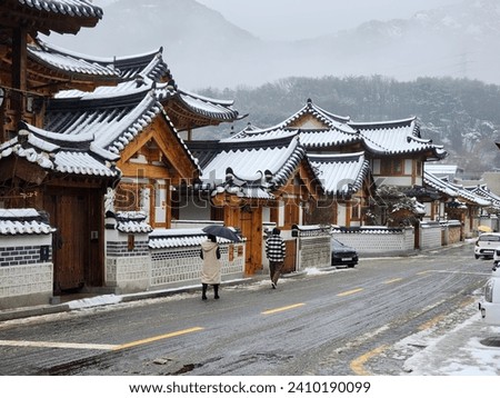 Korean's famous traditional houses called Han-ok. It's yellow ish colour gives a great contrast in white snow.  