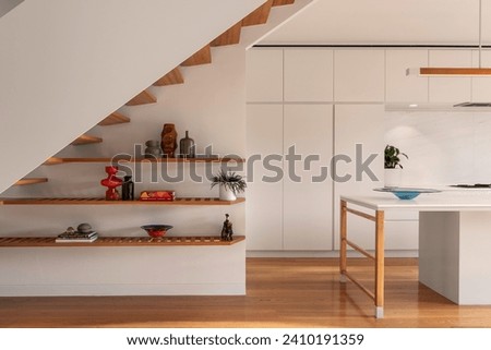 Interior design shelves under stairs and kitchen