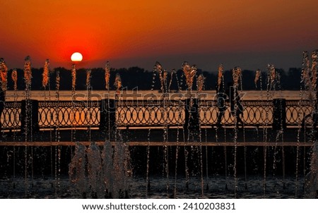 beautiful summer sunset on the Volga River embankment in the city of Samara Royalty-Free Stock Photo #2410203831