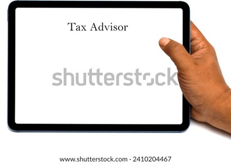 hand holding a computer tablet with a screen displaying the words tax advisor.  taxation concept