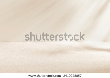 Blank warm lighting background. White and Fabric surface. Light and Shadow wallpaper.Space for text. Backdrop. Studio photography.Cozy and Comfortable.Beige backdrop. Minimalist wallpaper.Empty space.