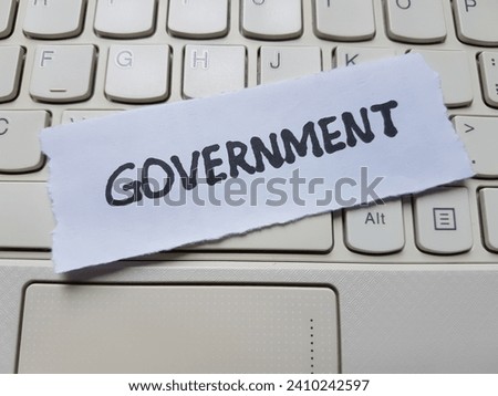 Government written on laptop keyboard background.
