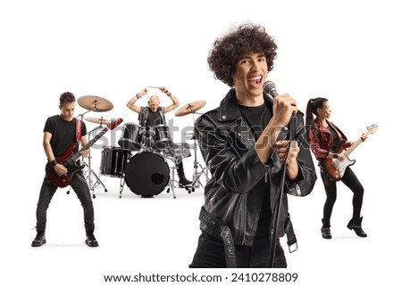 Rock music band performing with a male lead singer isolated on white background Royalty-Free Stock Photo #2410278809