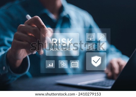 Risk management concept. Businessman use laptop with Risk analysis in business decisions. Risk control and management strategies for risky businesses. Royalty-Free Stock Photo #2410279153