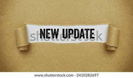 Torn paper revealing the words New Update