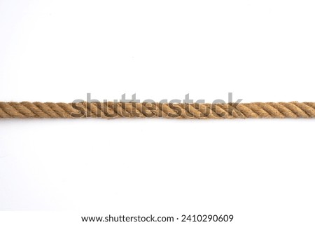 Thick rope on white background Royalty-Free Stock Photo #2410290609
